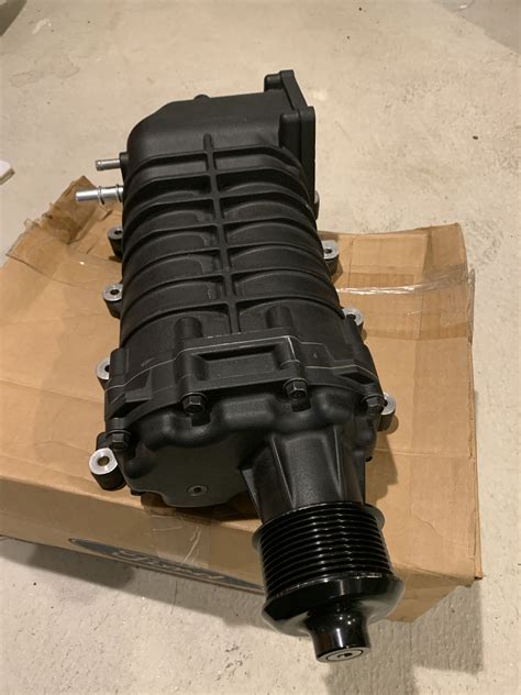 The difference between a supercharger and a blower is that a supercharger is mounted to the front of a vehicle and piped to the intake, whereas a blower is mounted to the intake on the block. . M122 supercharger